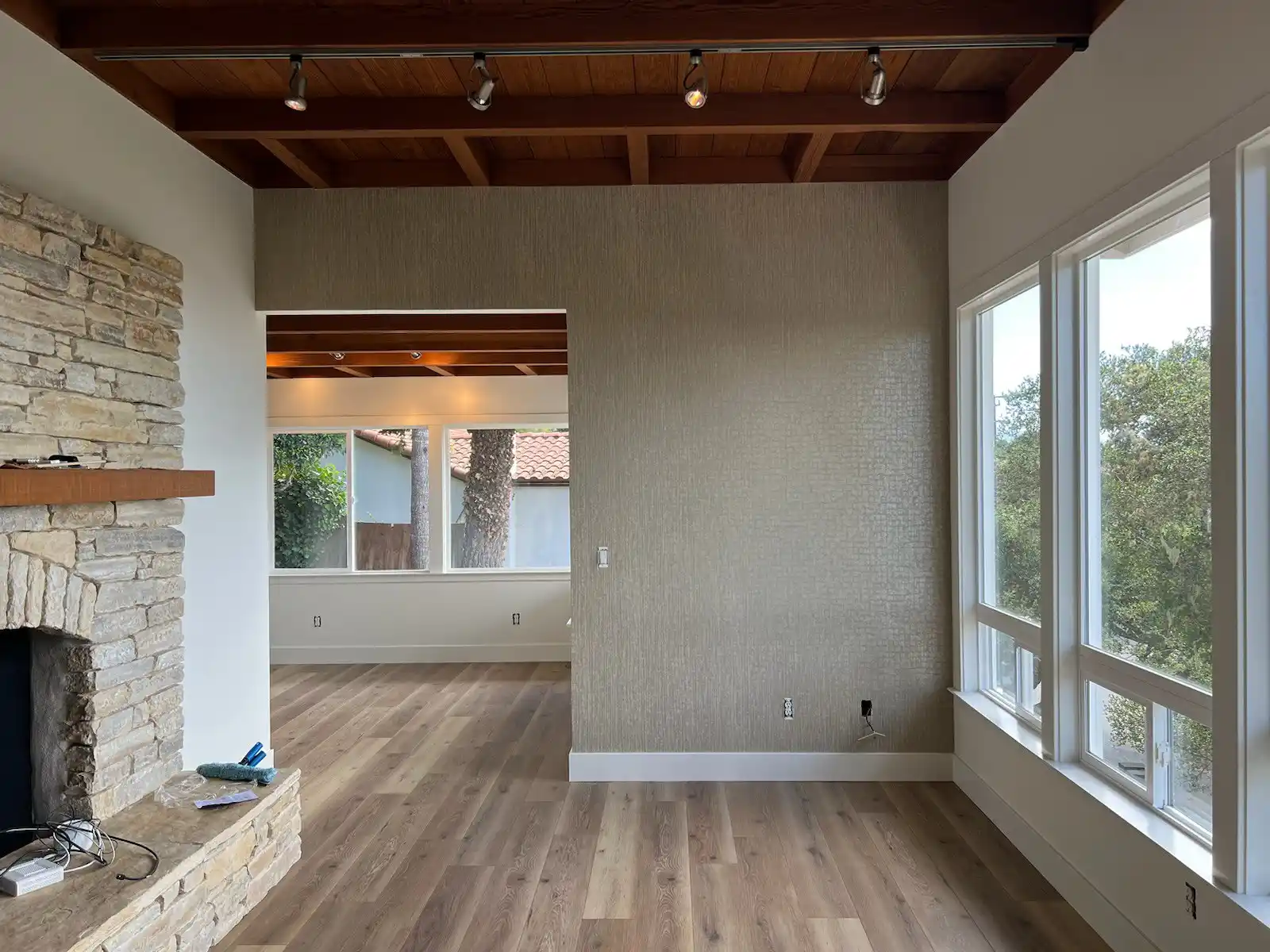 Expert wallpaper installer smoothing out a seam in South Eola, Orlando